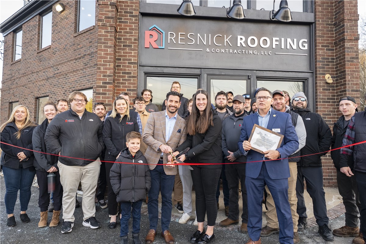 Ribbon-cutting event with the Resnick Roofing team