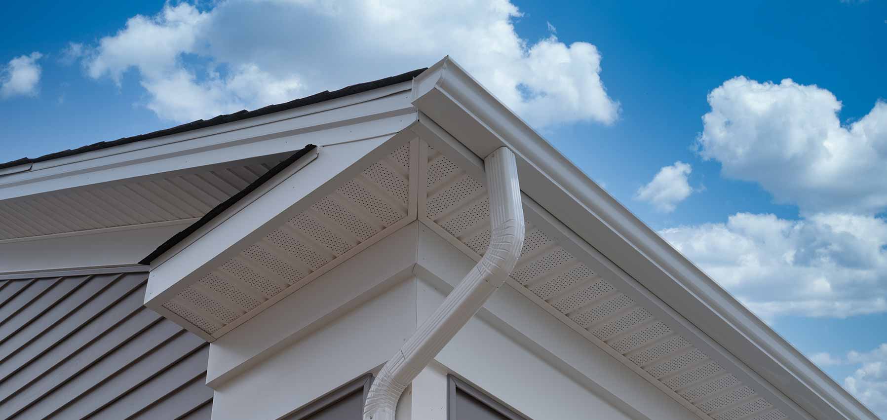 Close-up of a premium box gutter against a blue sky